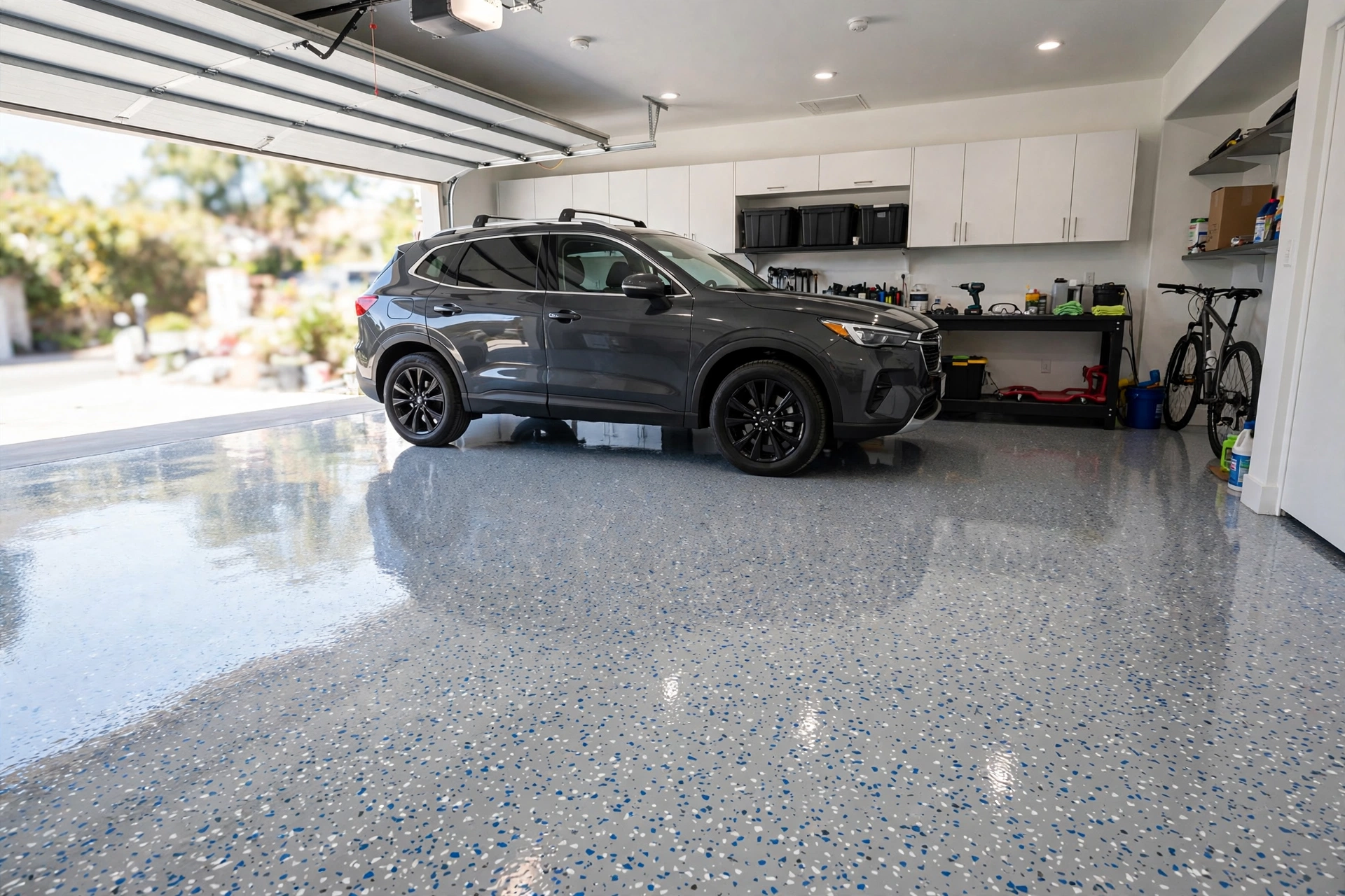 Garage floor finished in epoxy with a decorative flake broadcast in a terrazzo-like speckle pattern